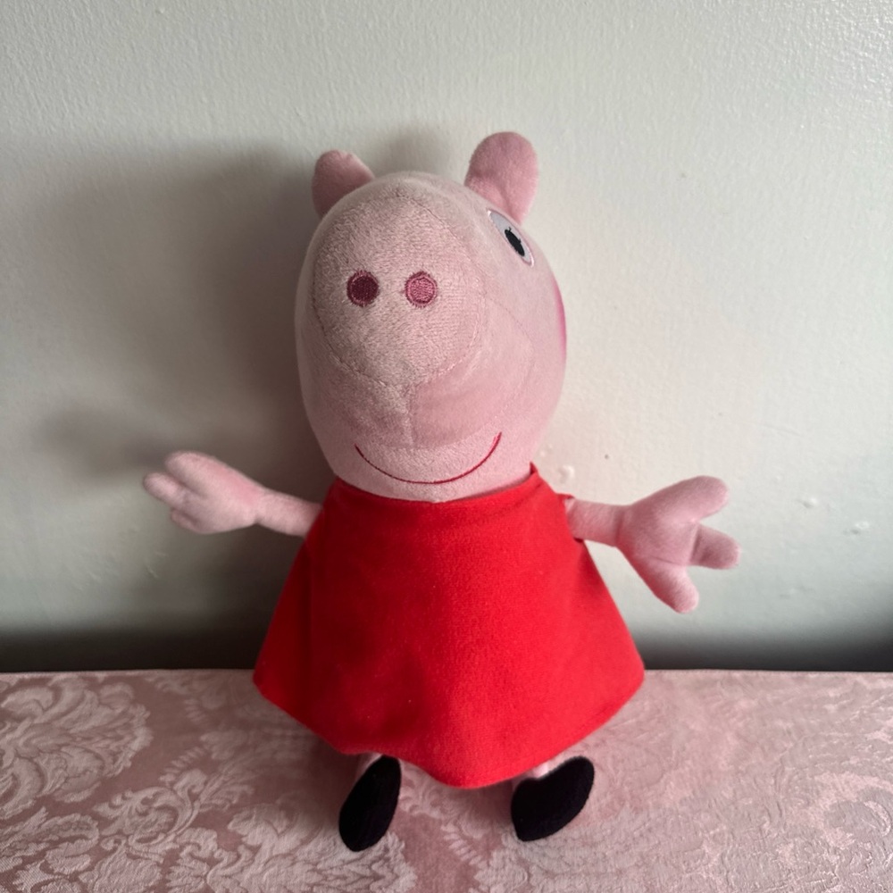 Peppa pig plushie with red dress
